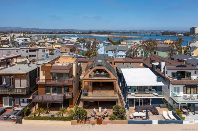 an aerial view of a house with outdoor space
