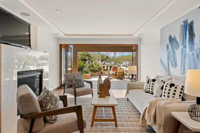 a view of living room with a table and chairs