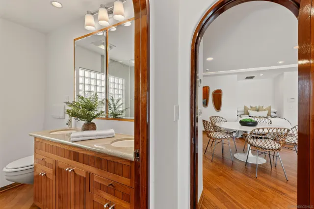 a bedroom with a bed and a potted plant