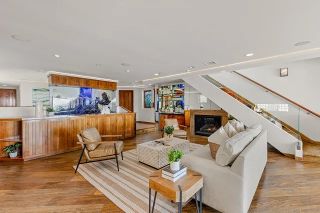 a living room with furniture and flowers