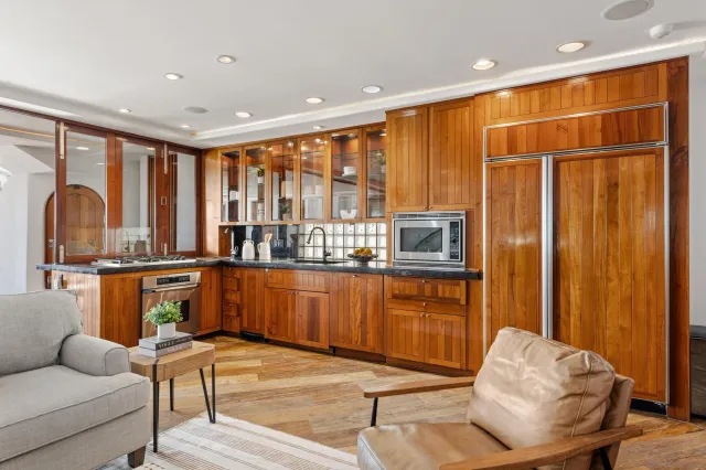a bathroom with a double vanity sink mirror and shower