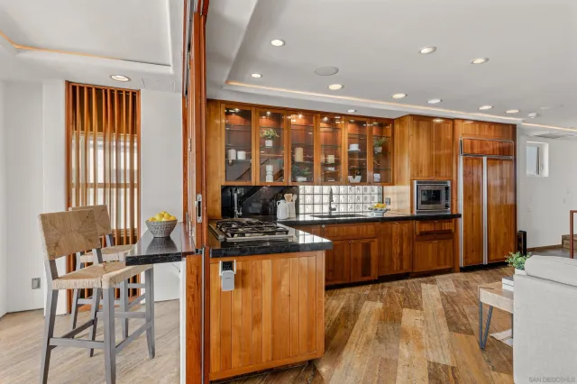 a bedroom with a bed and mirror