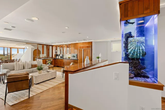 a bathroom with a granite countertop sink a large mirror and shower