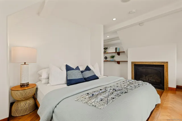 a bathroom with a granite countertop sink a mirror and a bathtub