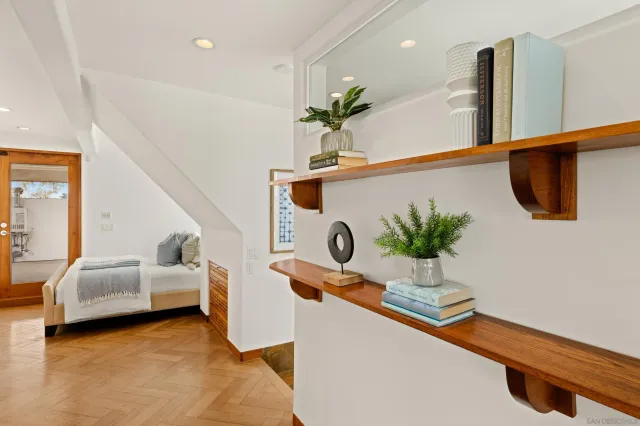 a kitchen with sink and view of living room