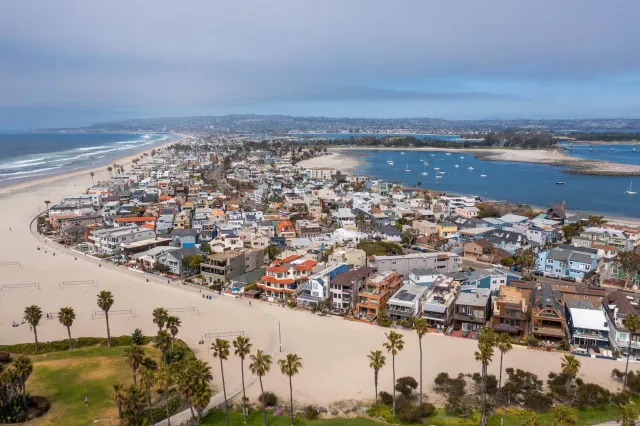 a view of multiple houses with a yard