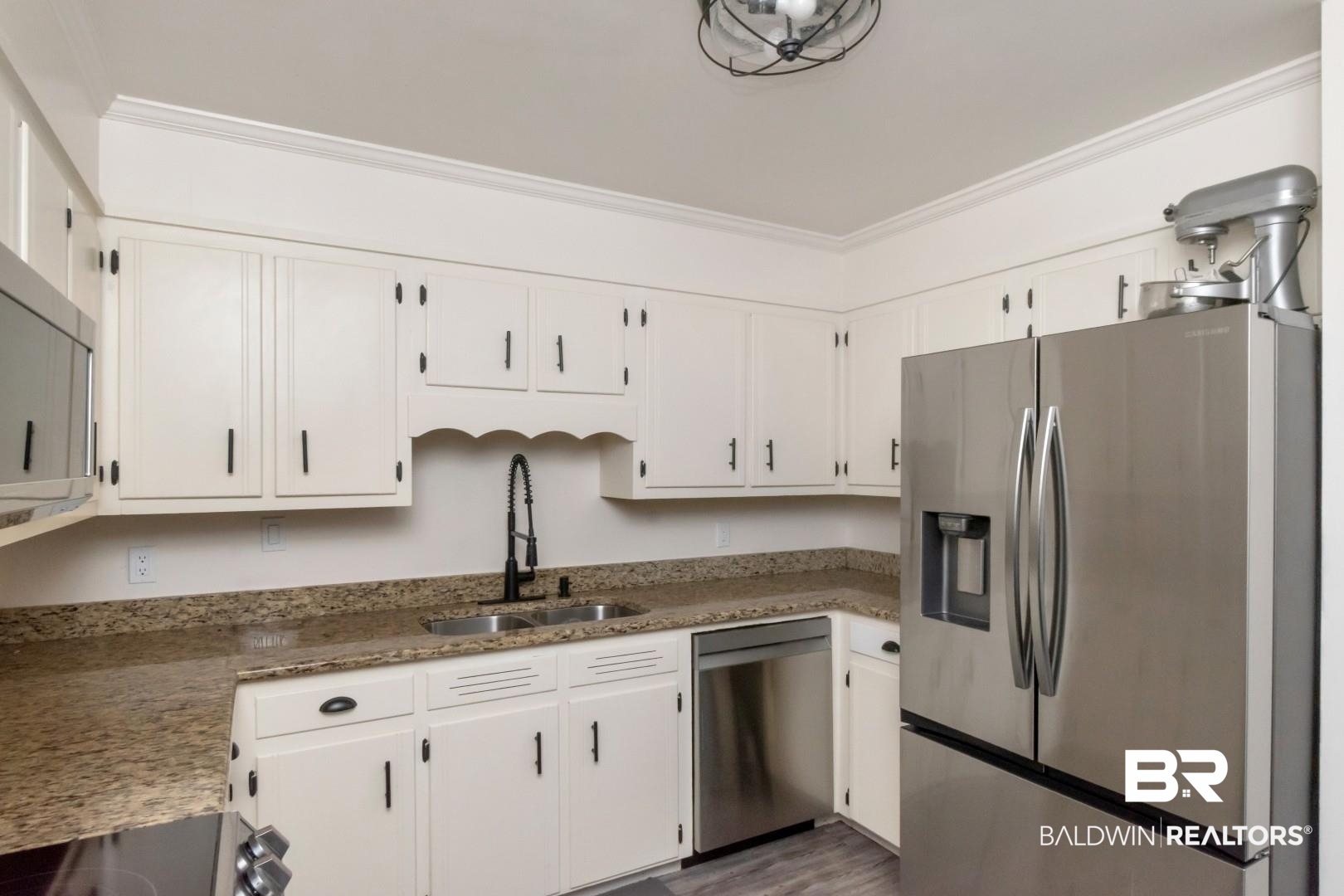 9410 Ashwood Court Mobile, AL 36695 - Photo 10 of 20 Kitchen featuring stainless steel appliances, light stone counters, white cabinets, dark wood-type flooring, and ornamental molding