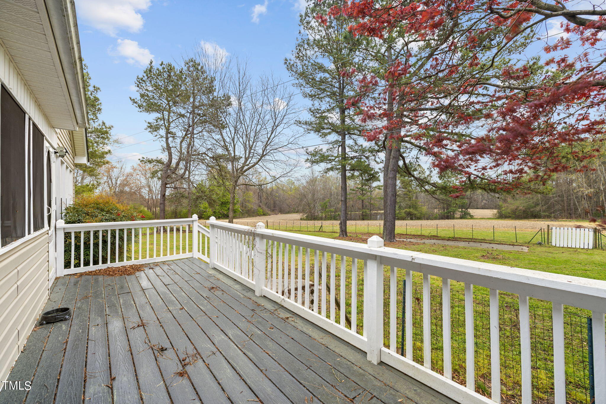 244 Ferrells Bridge Road Bunn, NC 27508 - Photo 11 of 36 a view of balcony with wooden floor and fence