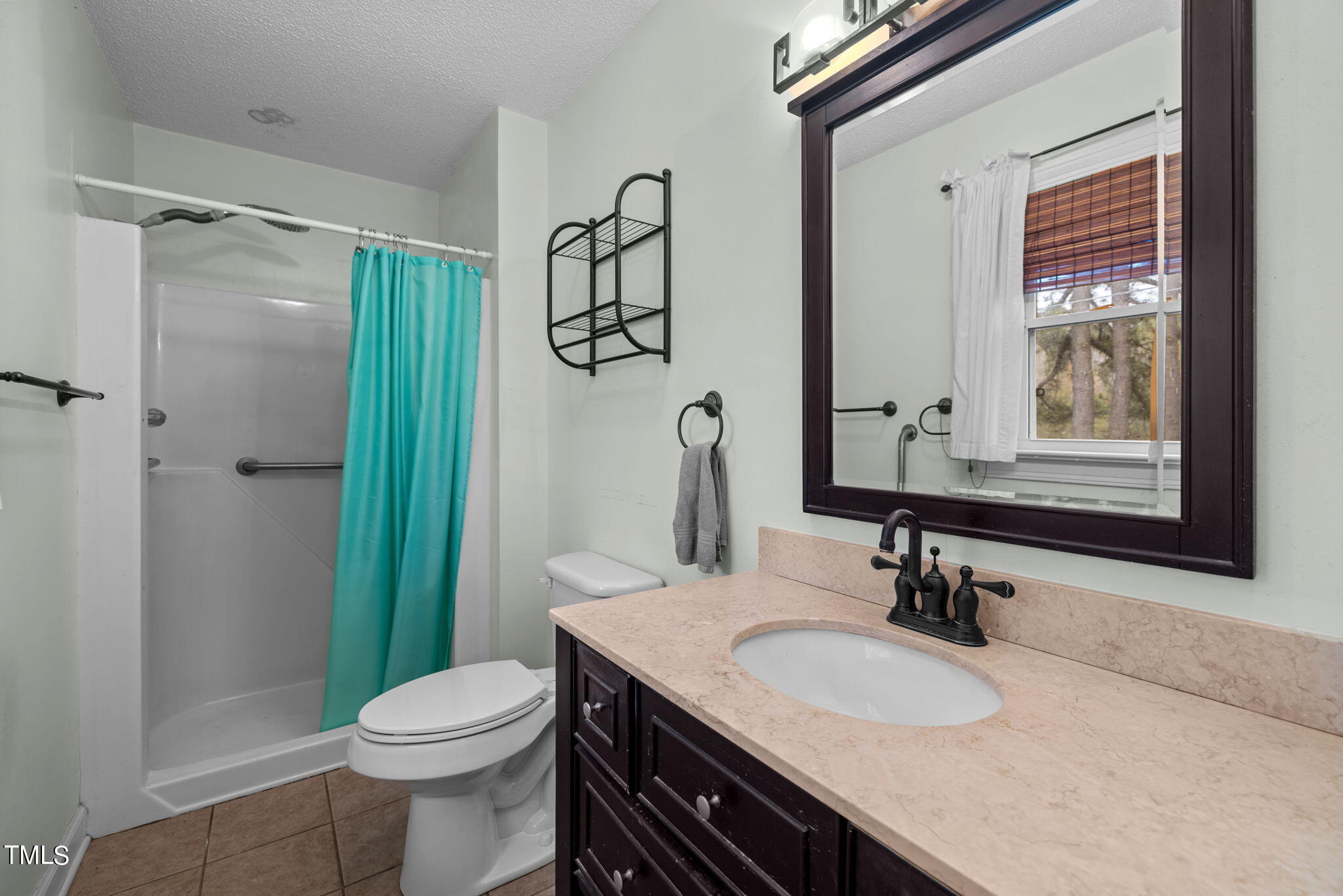 244 Ferrells Bridge Road Bunn, NC 27508 - Photo 14 of 36 a bathroom with a granite countertop sink toilet and shower