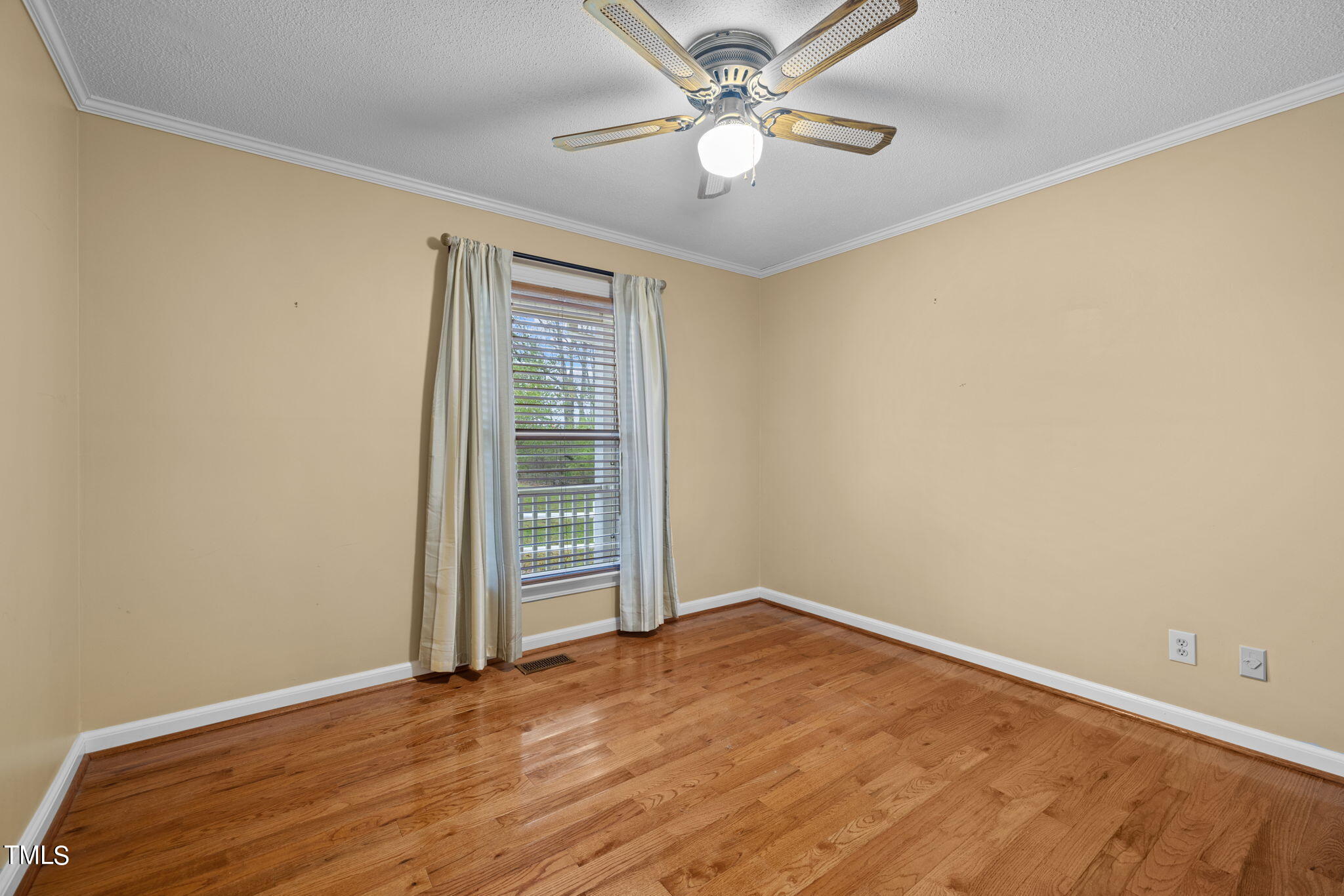 244 Ferrells Bridge Road Bunn, NC 27508 - Photo 15 of 36 an empty room with a empty space and a ceiling fan