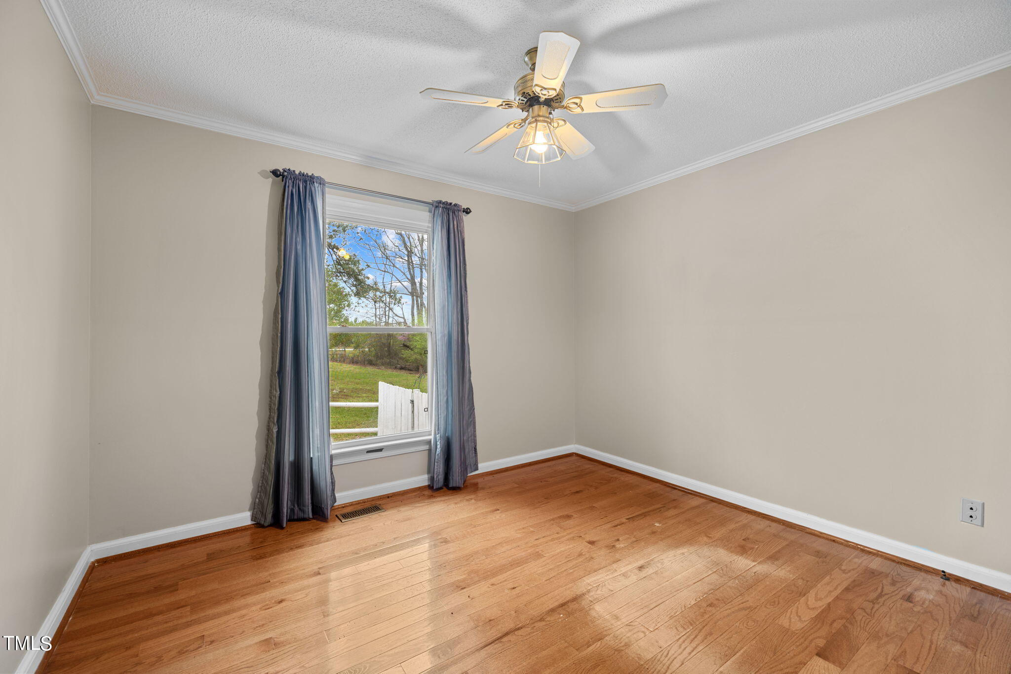 244 Ferrells Bridge Road Bunn, NC 27508 - Photo 16 of 36 a view of an empty room with a window