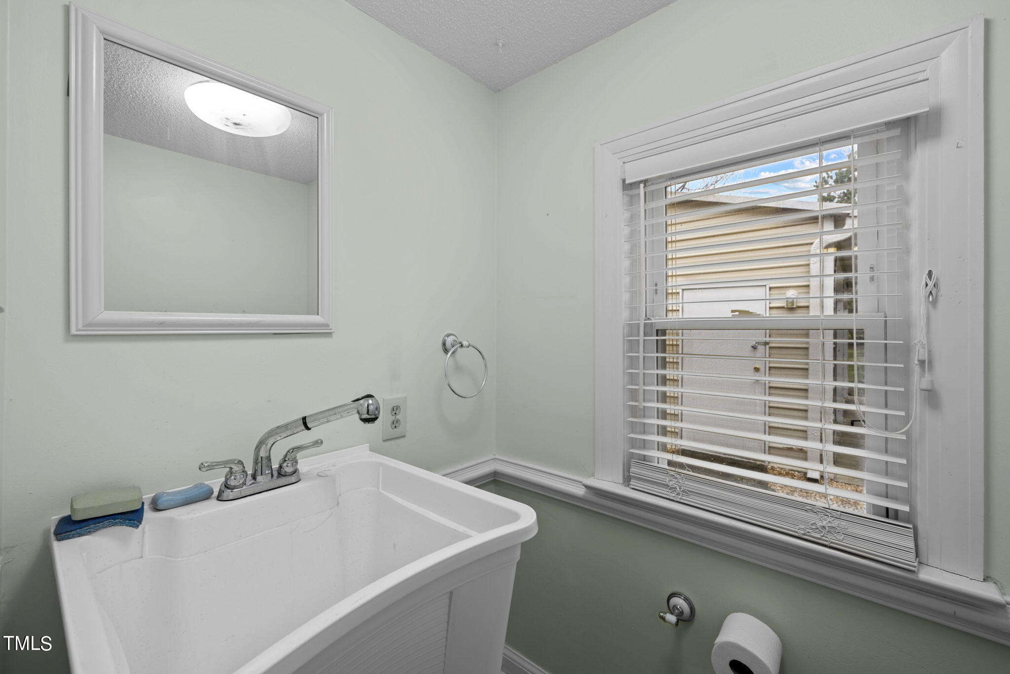 244 Ferrells Bridge Road Bunn, NC 27508 - Photo 21 of 36 a bathroom with a sink and a mirror