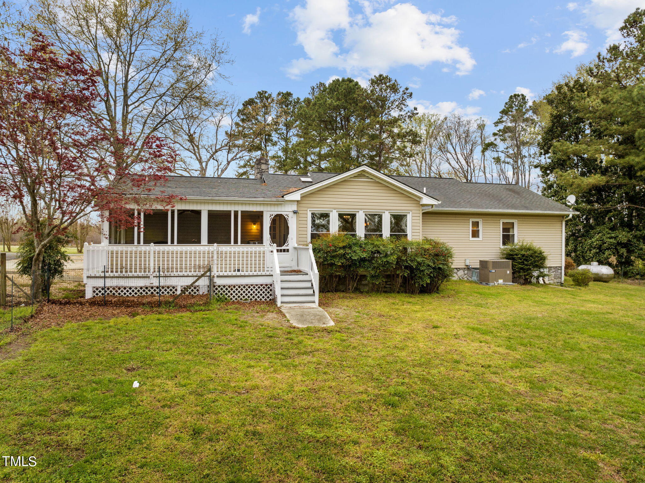 244 Ferrells Bridge Road Bunn, NC 27508 - Photo 24 of 36 a front view of a house with a garden