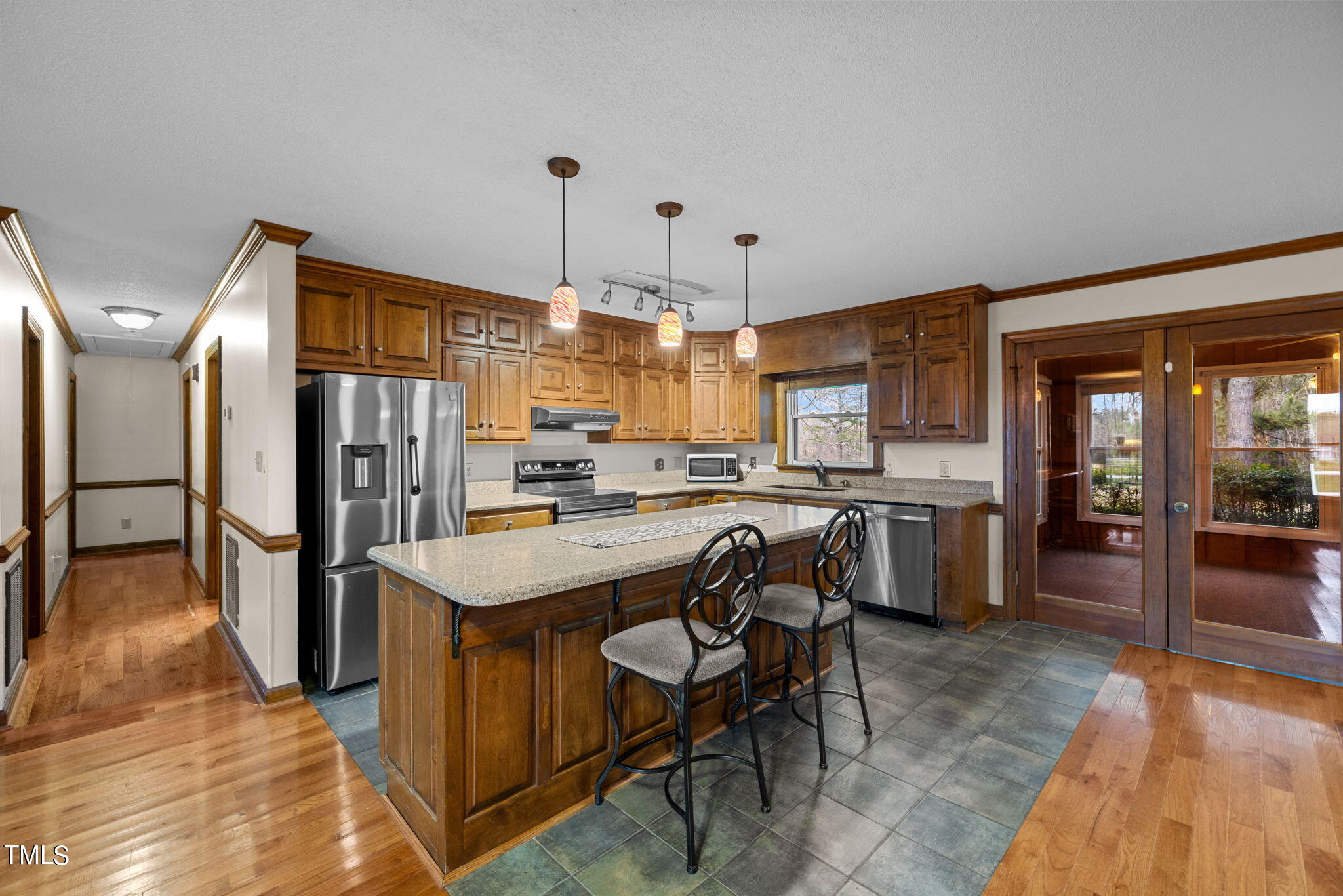 244 Ferrells Bridge Road Bunn, NC 27508 - Photo 4 of 36 a kitchen with refrigerator and cabinets