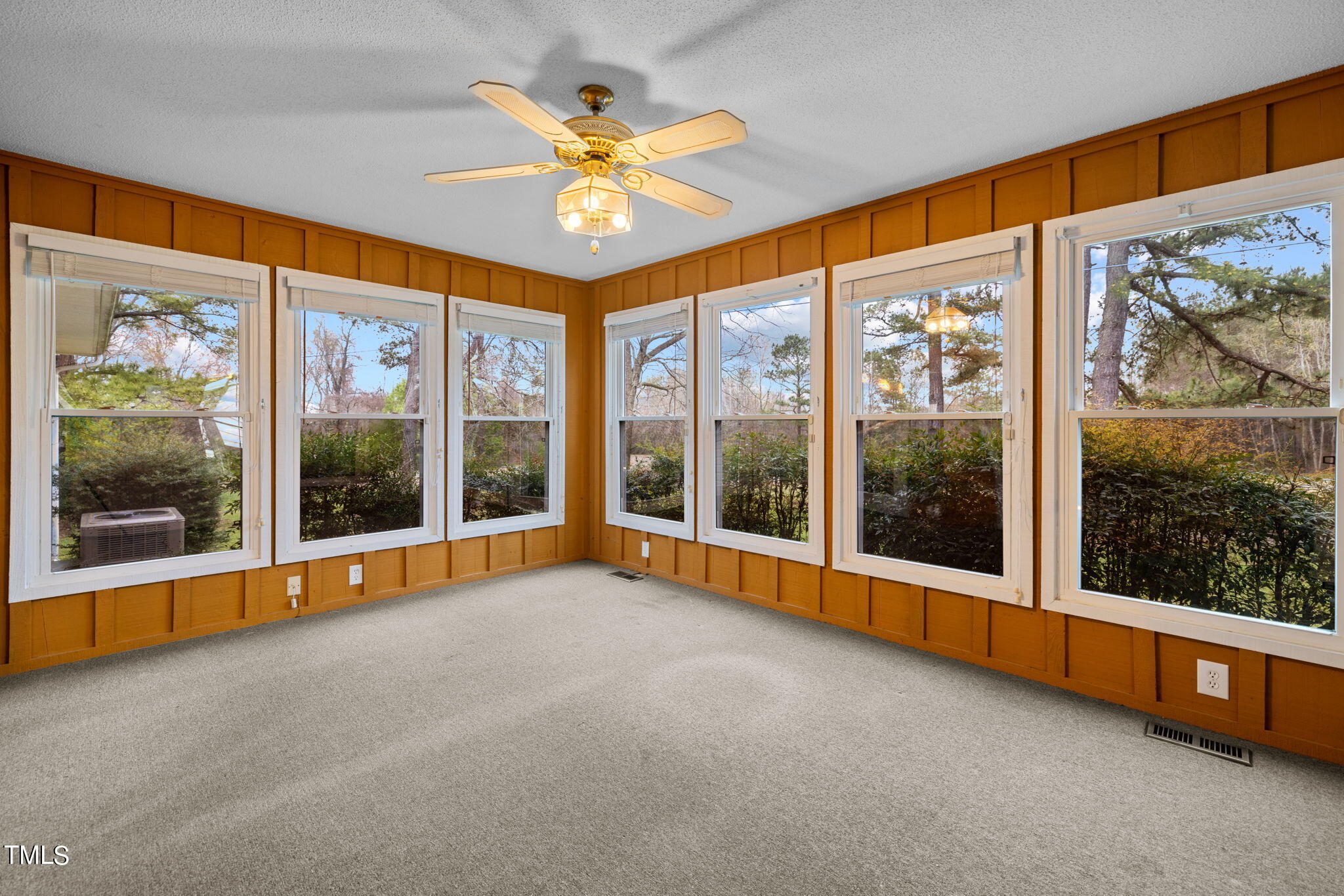 244 Ferrells Bridge Road Bunn, NC 27508 - Photo 8 of 36 a view of an empty room with a floor to ceiling window and an entryway