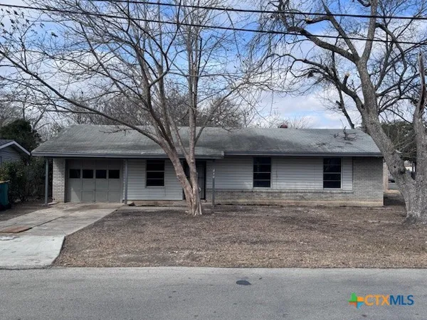 a front view of a house with yard