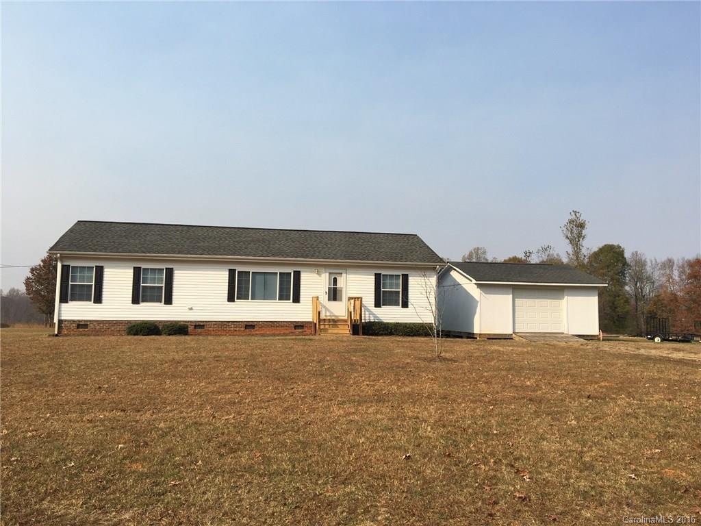 4860 Yoder Road Crouse, NC 28033 - Photo 2 of 20 a house that has a tree in front of it