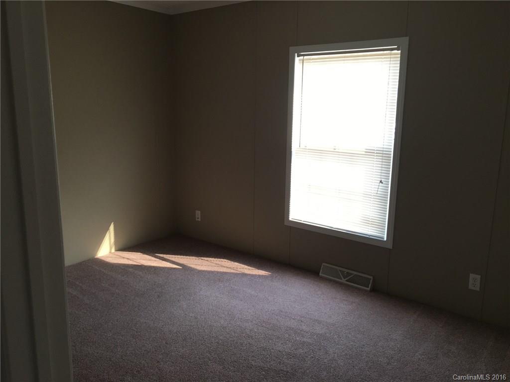 4860 Yoder Road Crouse, NC 28033 - Photo 12 of 20 a view of an empty room with a window