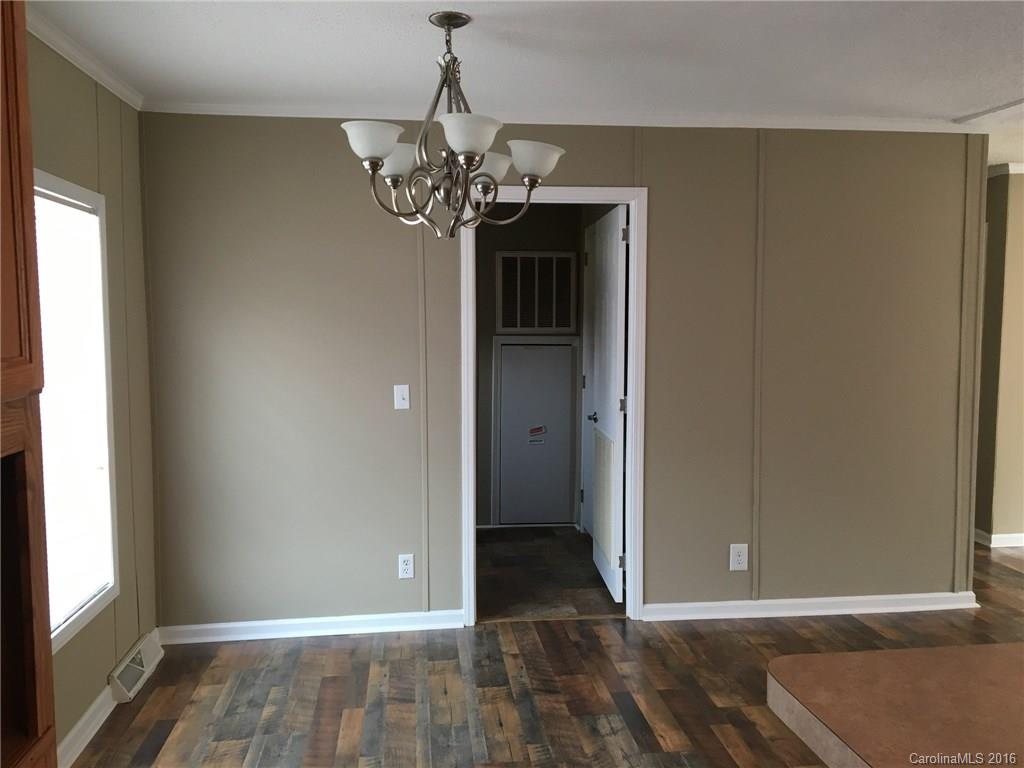 4860 Yoder Road Crouse, NC 28033 - Photo 18 of 20 a view of a livingroom with a chandelier fan and windows