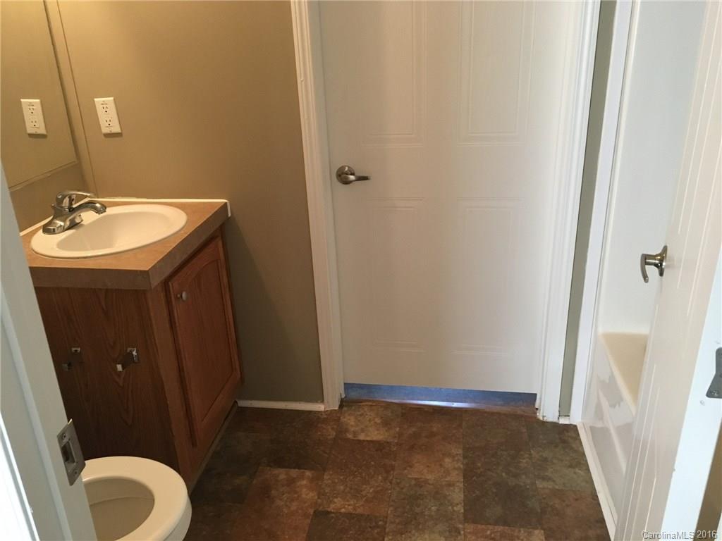 4860 Yoder Road Crouse, NC 28033 - Photo 10 of 20 a bathroom with a sink and a mirror