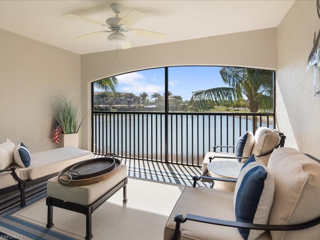 9532 Avellino Way, Unit 2726 Naples, FL 34113 - Photo 13 of 35 Sunroom / solarium featuring a water view