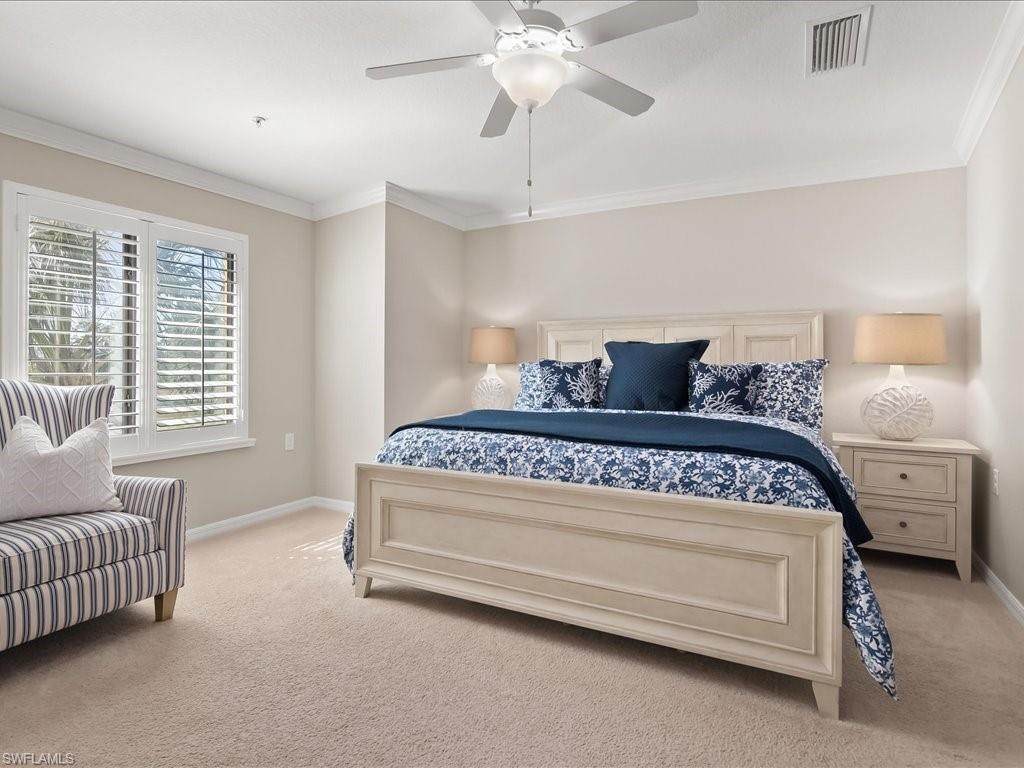 9532 Avellino Way, Unit 2726 Naples, FL 34113 - Photo 14 of 35 Carpeted bedroom featuring ornamental molding and a ceiling fan