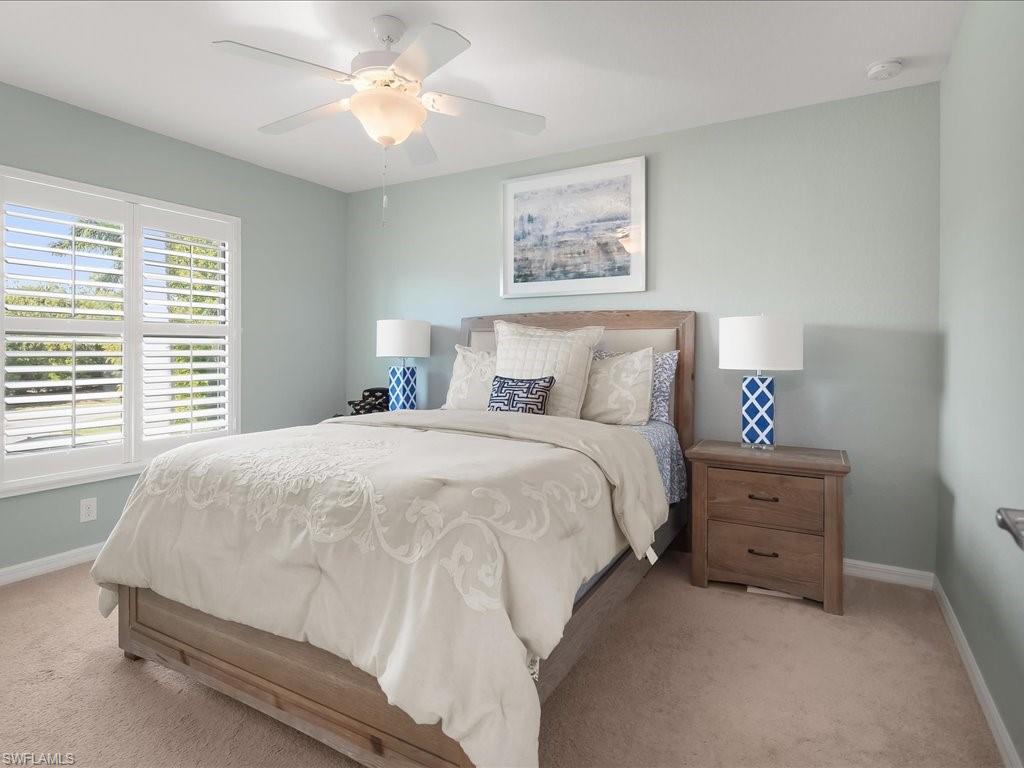 9532 Avellino Way, Unit 2726 Naples, FL 34113 - Photo 18 of 35 Bedroom featuring light colored carpet and ceiling fan
