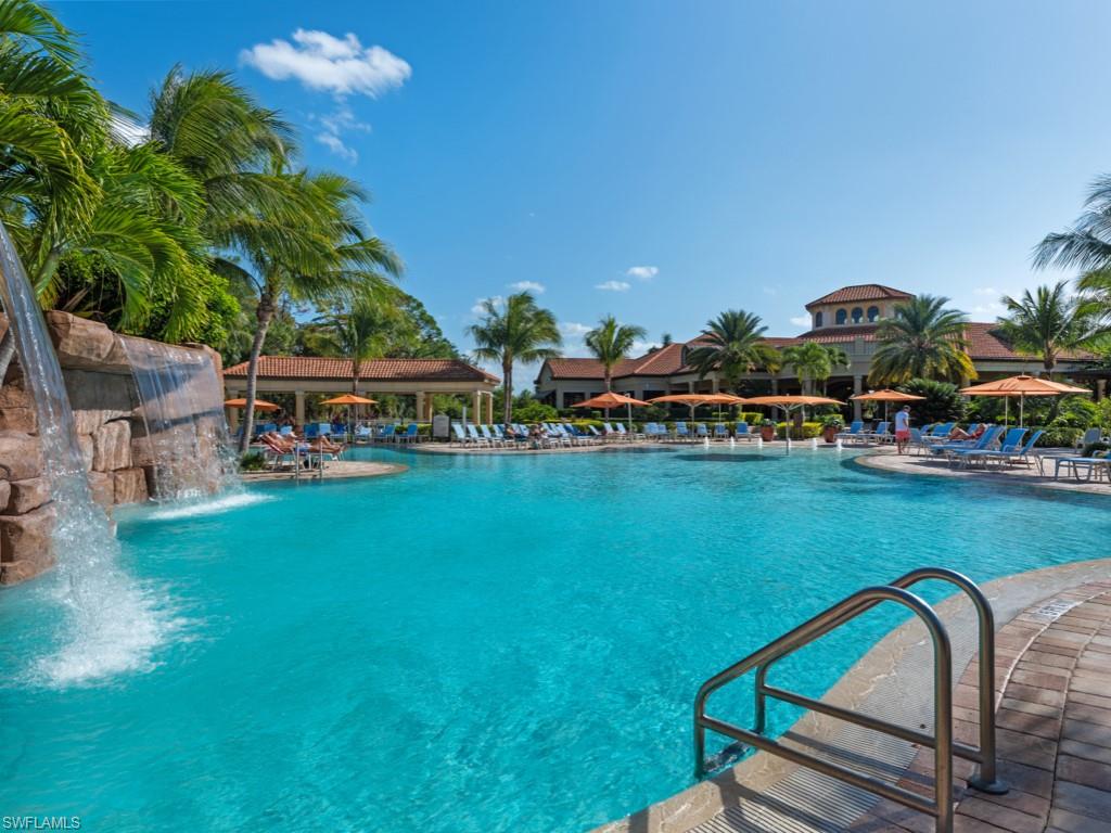 9532 Avellino Way, Unit 2726 Naples, FL 34113 - Photo 29 of 35 Community pool featuring a patio area