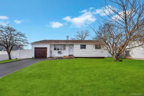 a front view of house with yard and seating area