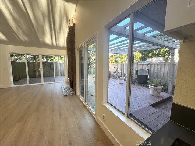 a view of an entryway with wooden floor