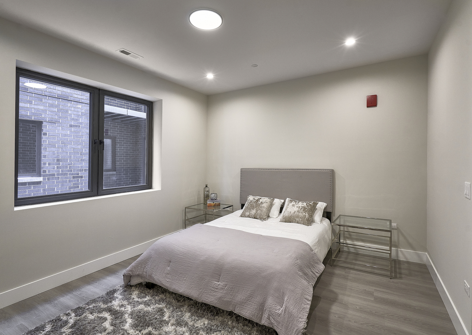 451 East Pershing Road, Unit 403 Chicago, IL 60653 - Photo 27 of 30 a bedroom with a bed and a window