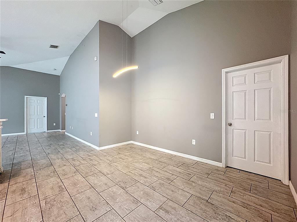 3477 Middlebrook Place Harmony, FL 34773 - Photo 23 of 78 a view of an empty room with wooden floor