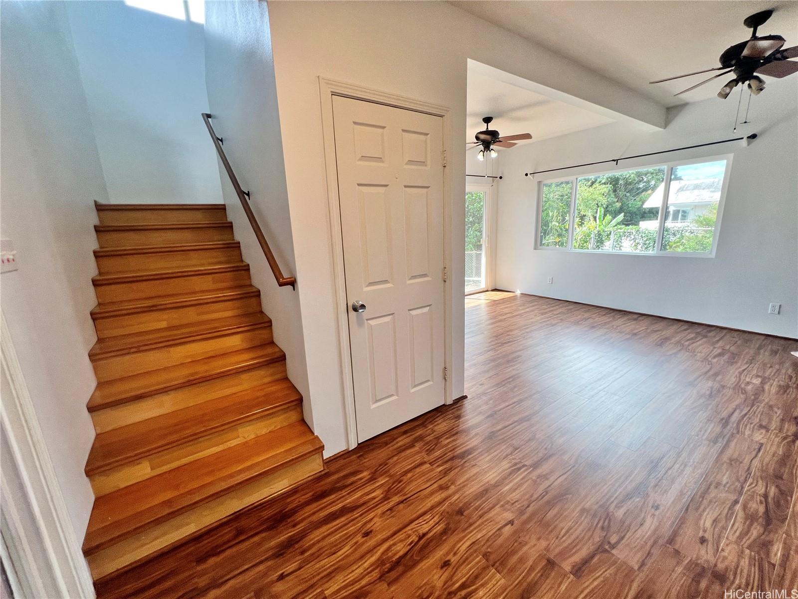 2407 Komo Mai Drive Pearl City, HI 96782 - Photo 11 of 25 wooden floor in an empty room with a window