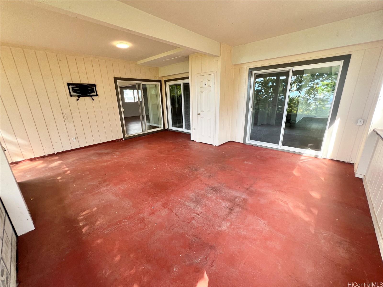 2407 Komo Mai Drive Pearl City, HI 96782 - Photo 21 of 25 a view of an empty room with glass door and balcony