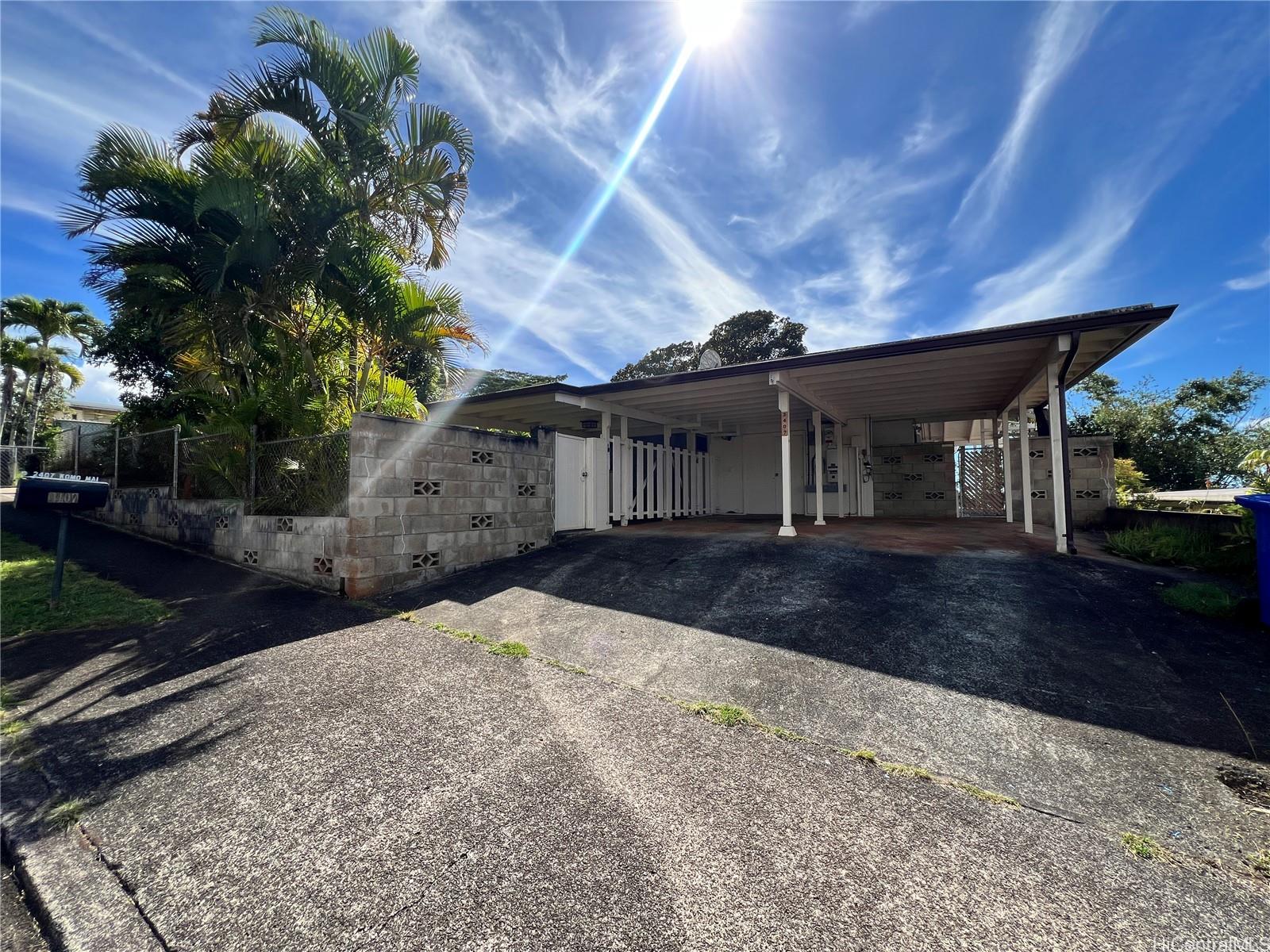 2407 Komo Mai Drive Pearl City, HI 96782 - Photo 25 of 25 a front view of a house with a yard