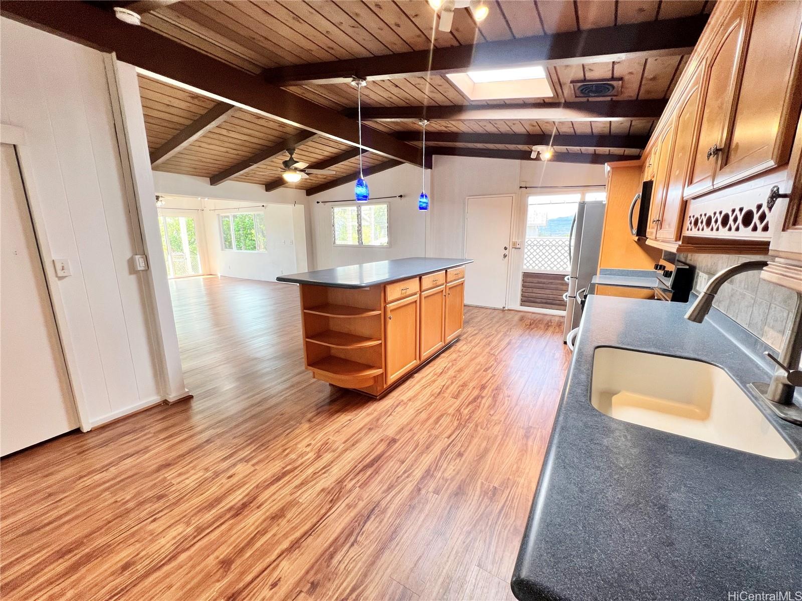 2407 Komo Mai Drive Pearl City, HI 96782 - Photo 4 of 25 a view of an empty room with wooden floor
