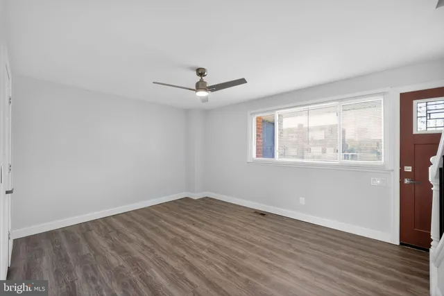 a view of a livingroom with wooden floor