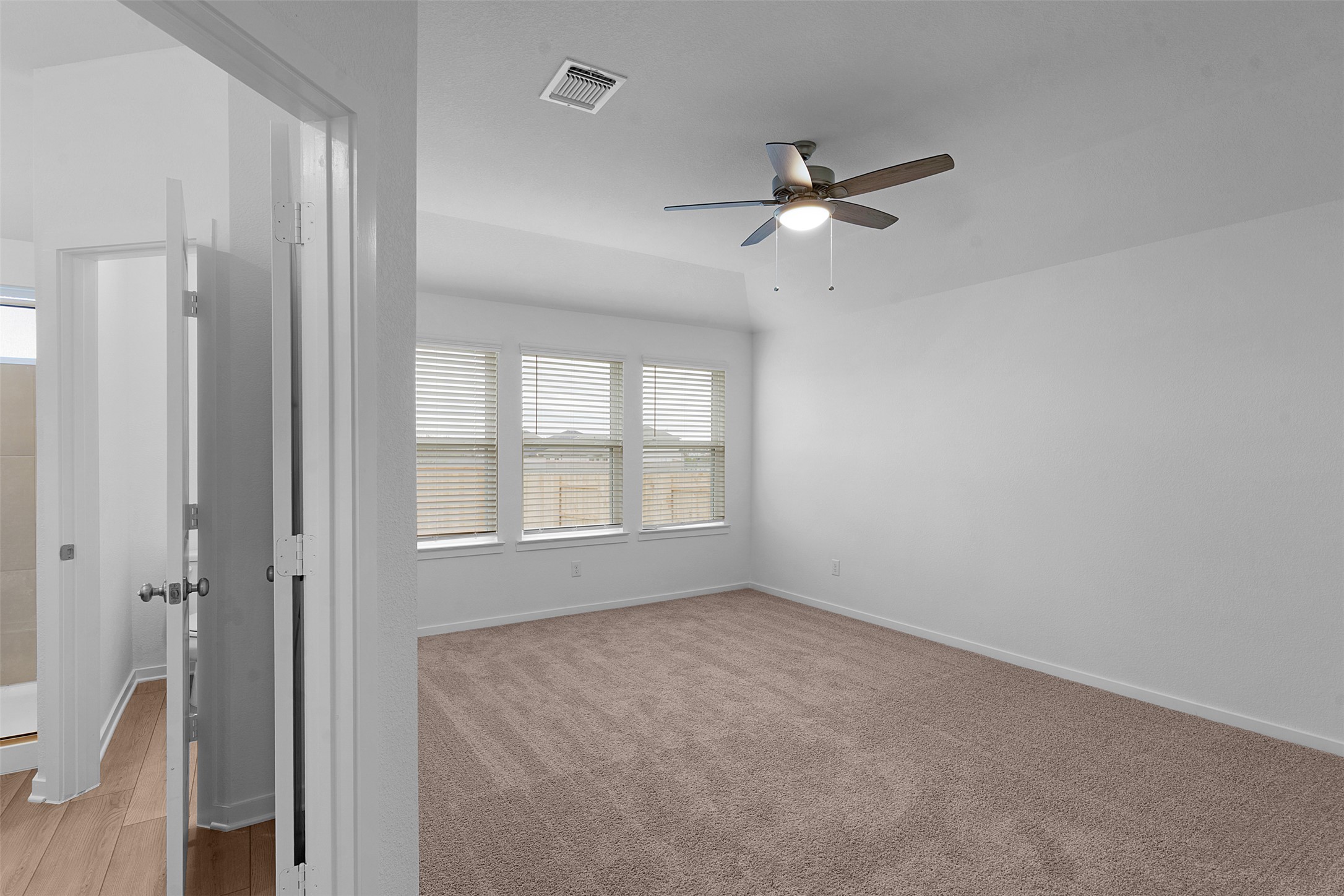 13721 Tucker Hedge Pass Elgin, TX 78621 - Photo 13 of 28 Spare room with healthy amount of natural light and ceiling fan