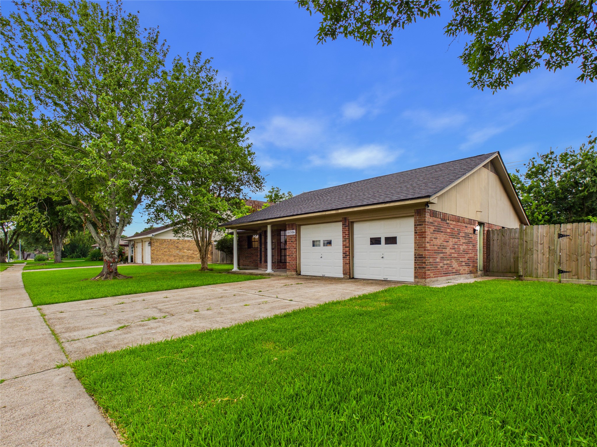 10306 Rustic Rock Road La Porte, TX 77571 - Photo 4 of 38 a front view of a house with a yard and garage