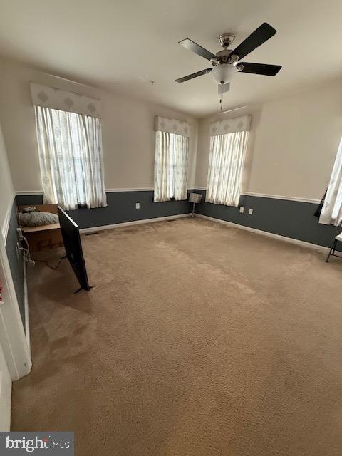 7106 Battle Field Loop Brandywine, MD 20613 - Photo 6 of 22 a view of a room with gym equipment and windows