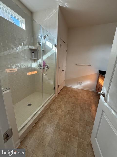 7106 Battle Field Loop Brandywine, MD 20613 - Photo 8 of 22 a bathroom with a shower