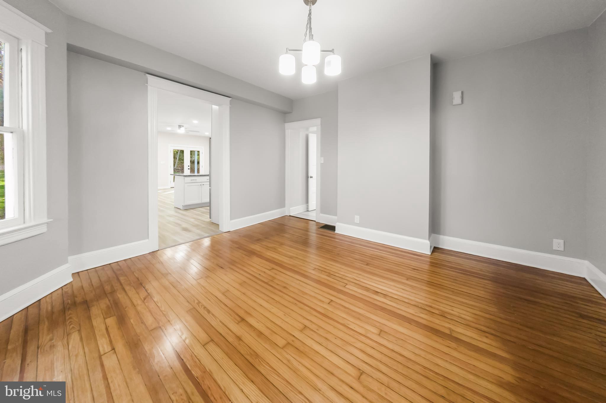 10220 Capitol View Avenue Silver Spring, MD 20910 - Photo 16 of 63 a view of a livingroom with wooden floor and a window