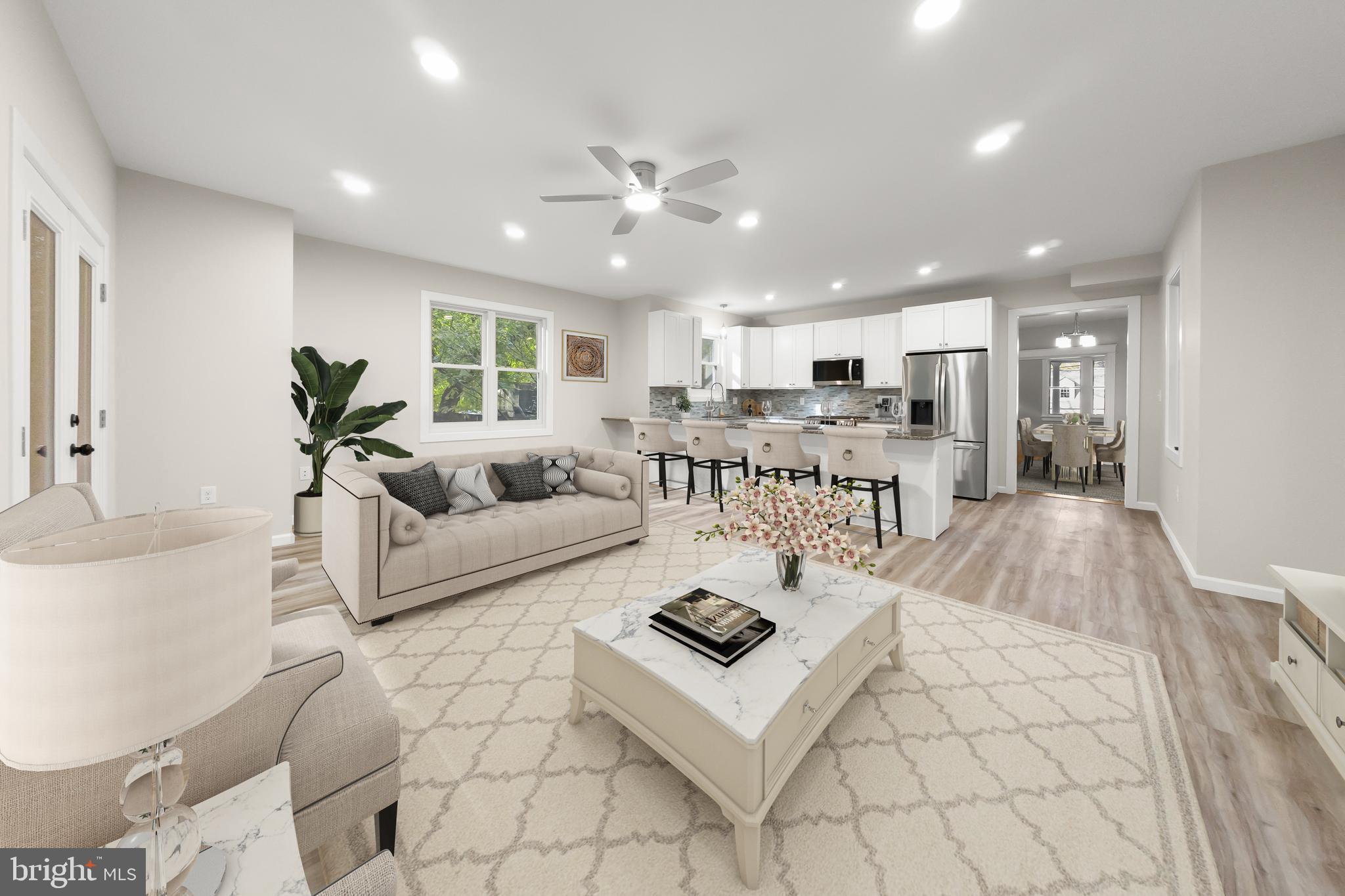 10220 Capitol View Avenue Silver Spring, MD 20910 - Photo 20 of 63 a living room with furniture and a large window