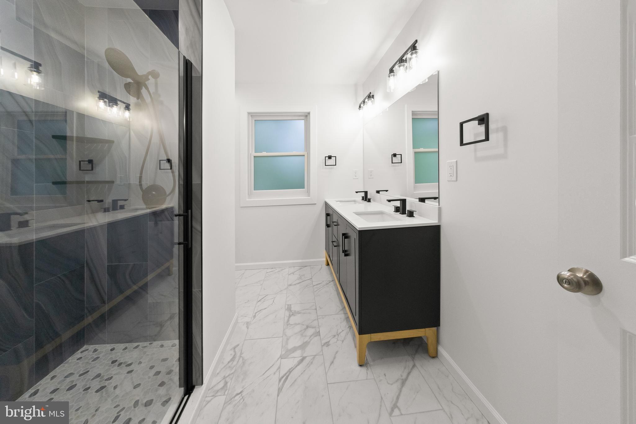 10220 Capitol View Avenue Silver Spring, MD 20910 - Photo 44 of 63 a bathroom with a sink a toilet and shower