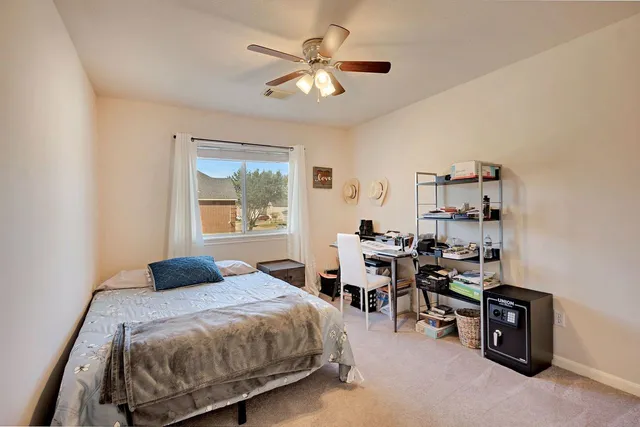 a bedroom with a bed and a table