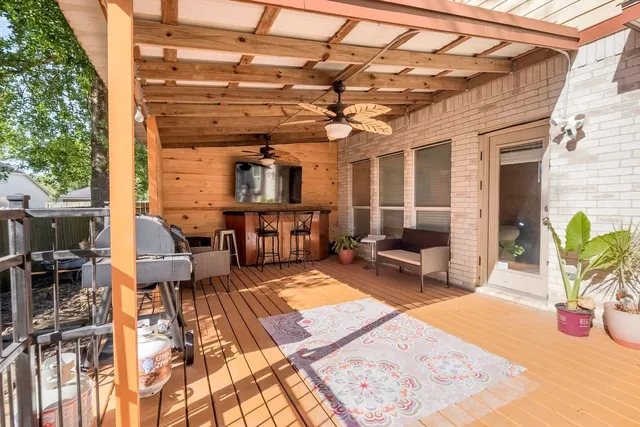 a view of a patio with a table and chairs