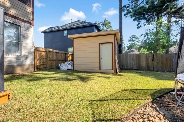 a view of a backyard of the house