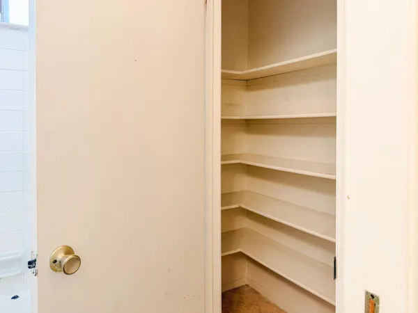 a view of an empty walk in closet