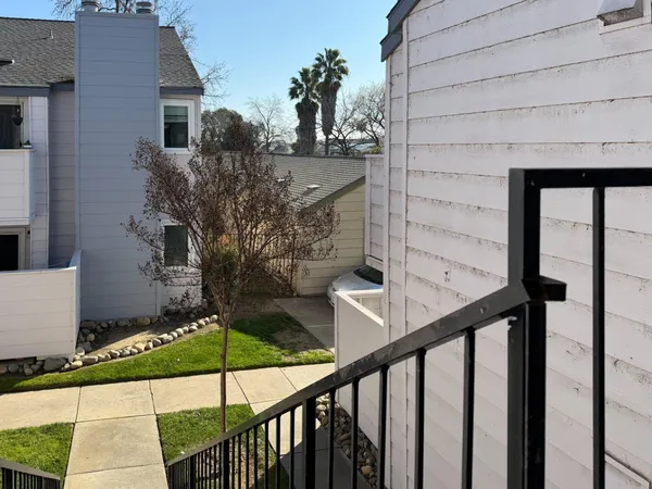 a view of balcony and yard