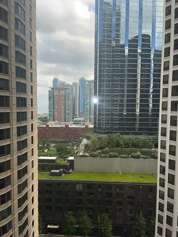a view of a bathroom with a shower and a sink